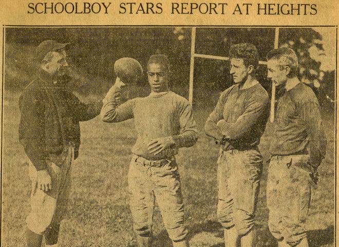 Lou Montgomery holding a football in an archival photo.